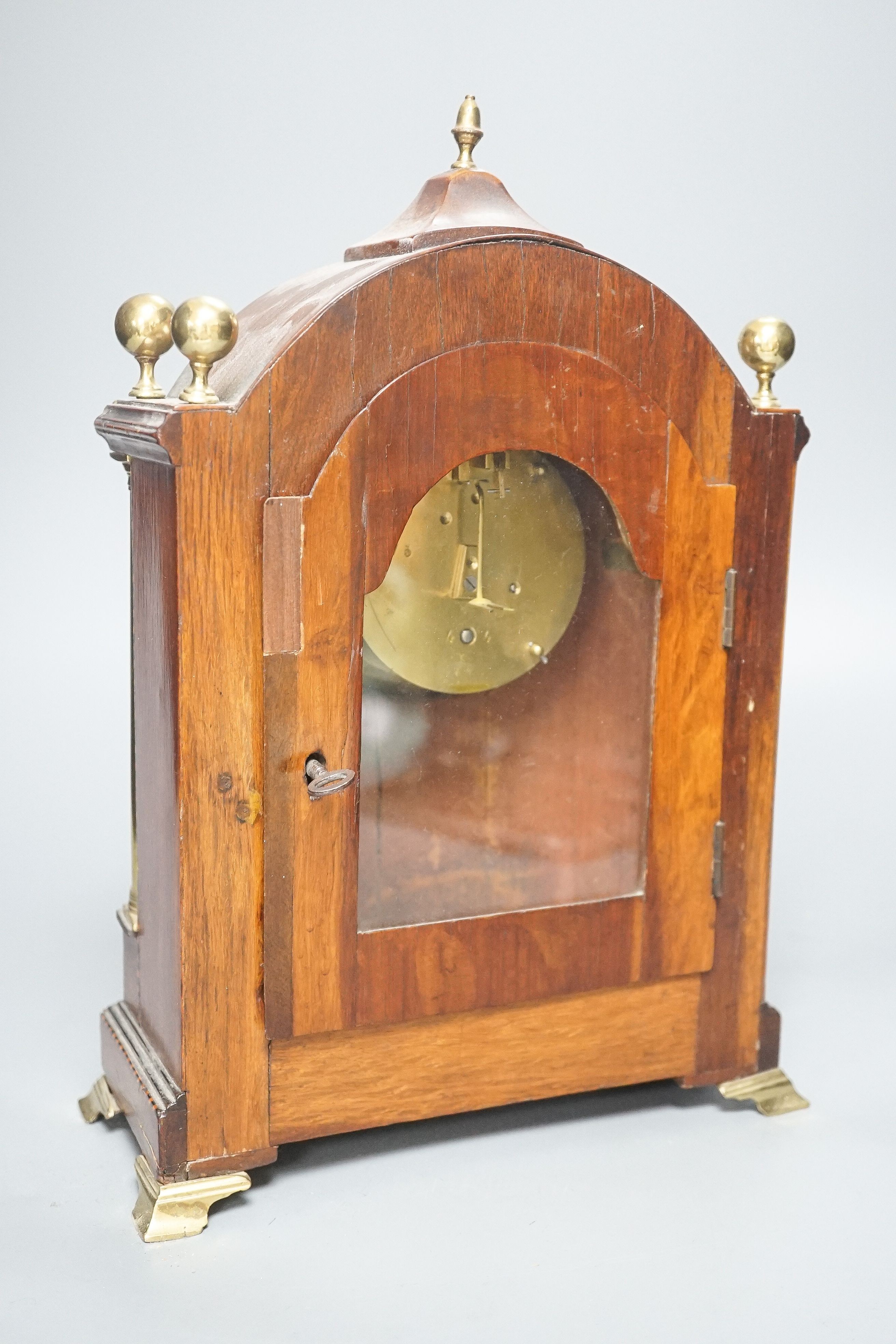 An Edwardian mahogany and marquetry arched mantel clock 30cm